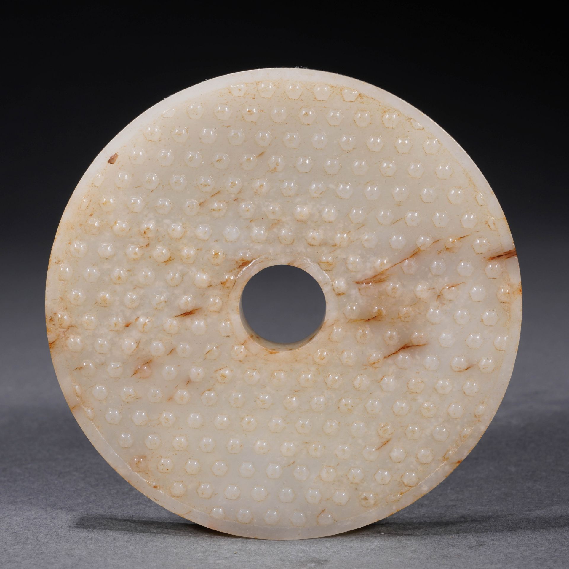 A Chinese Carved White Jade Disc Bi