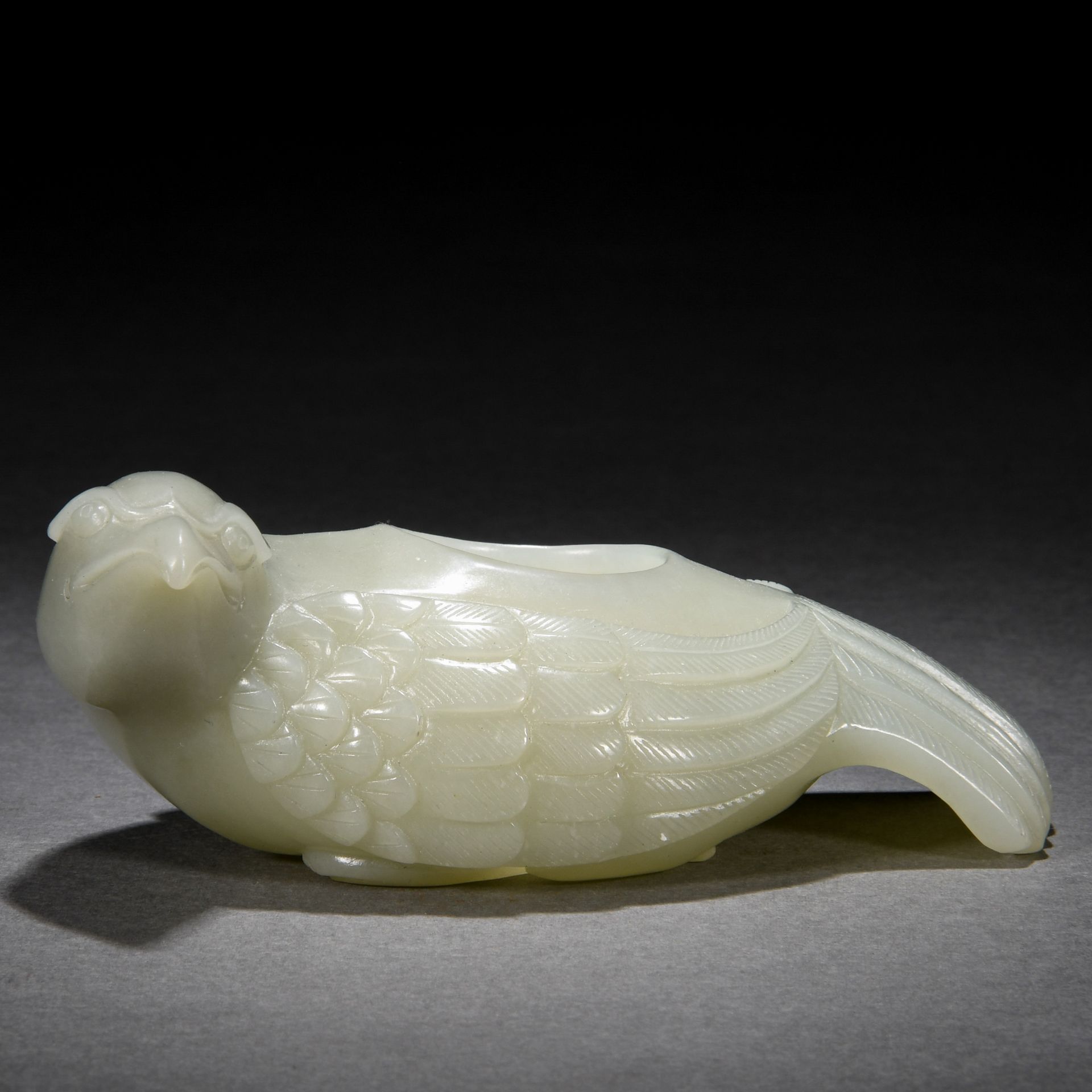 A Chinese Carved White Jade Bird-form Washer