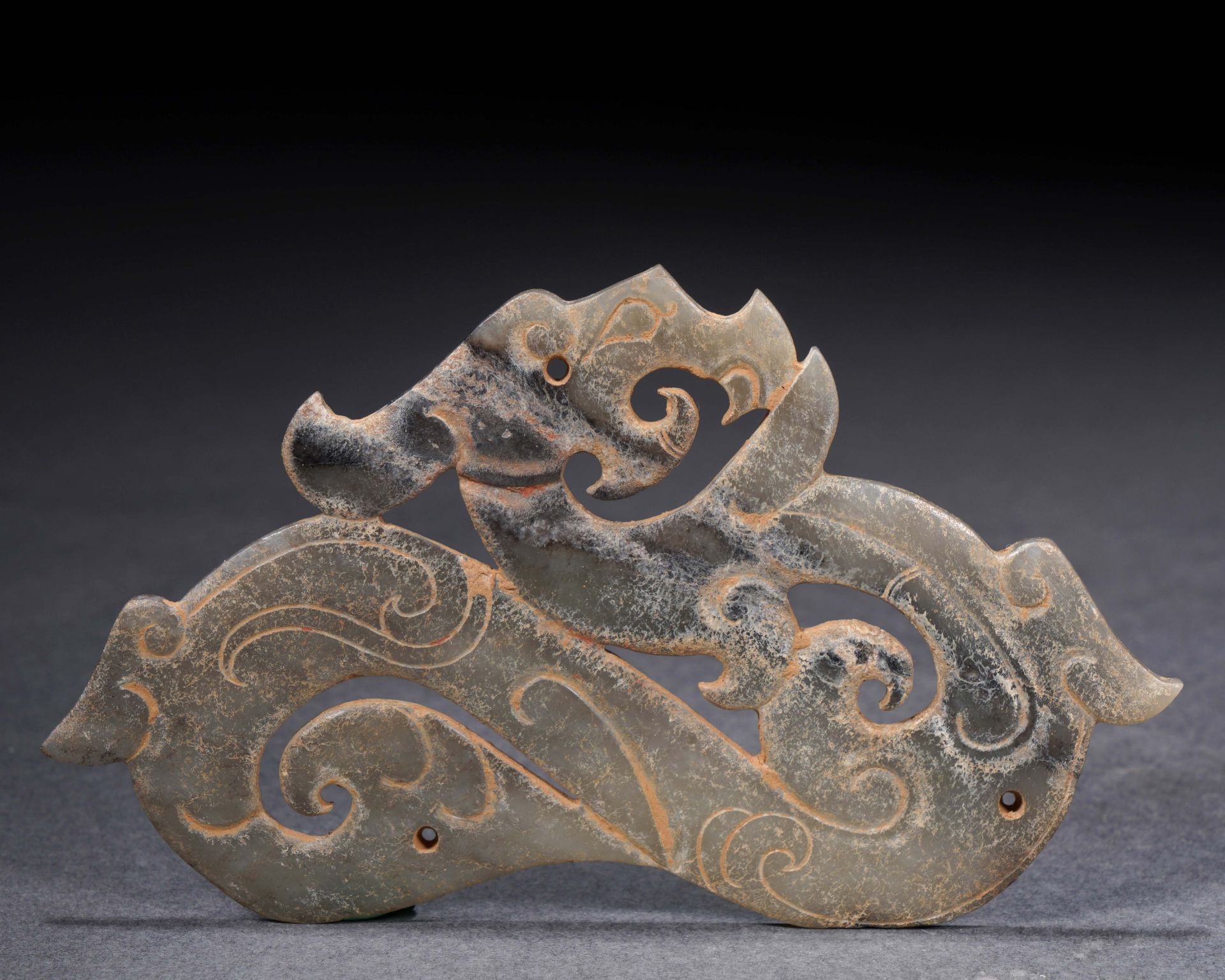 A Chinese Jade Dragon-Form Pendant