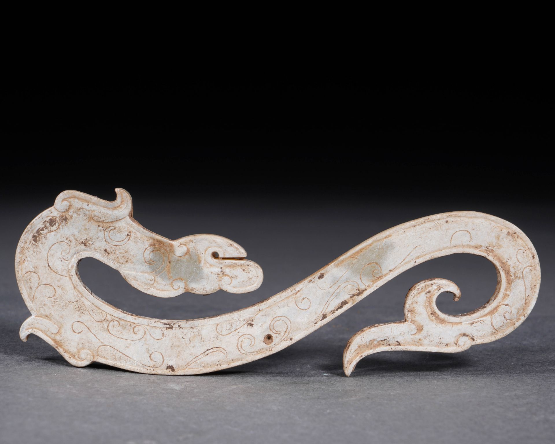 A Chinese Jade Dragon-Form Pendant