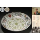 A Chinese Famille Rose Eight Treasures Plate