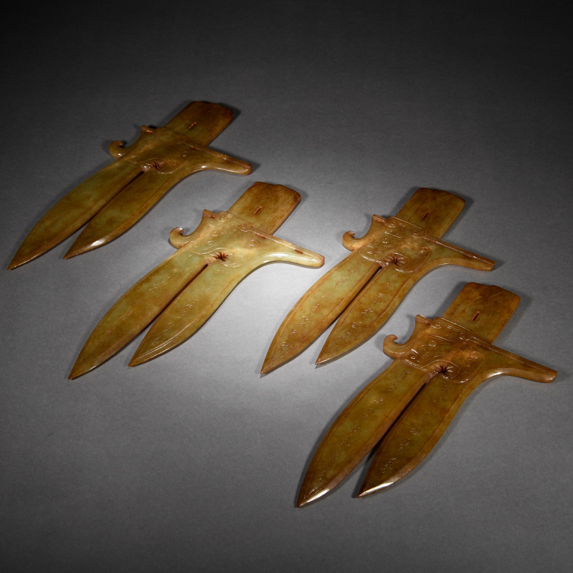 A Set of Four Chinese Carved Jade Blades