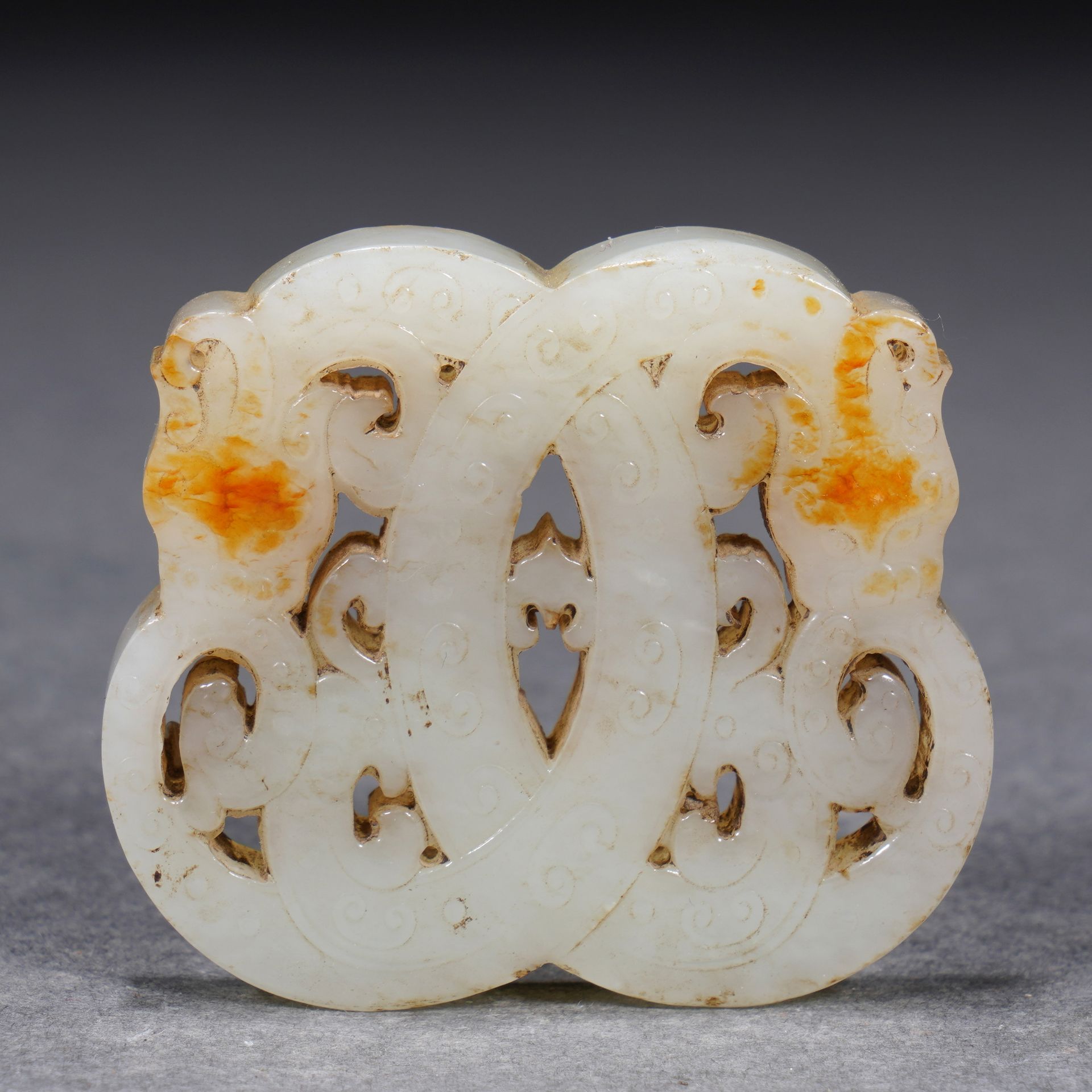 A Chinese Reticulated White Jade Interlocked Pendant