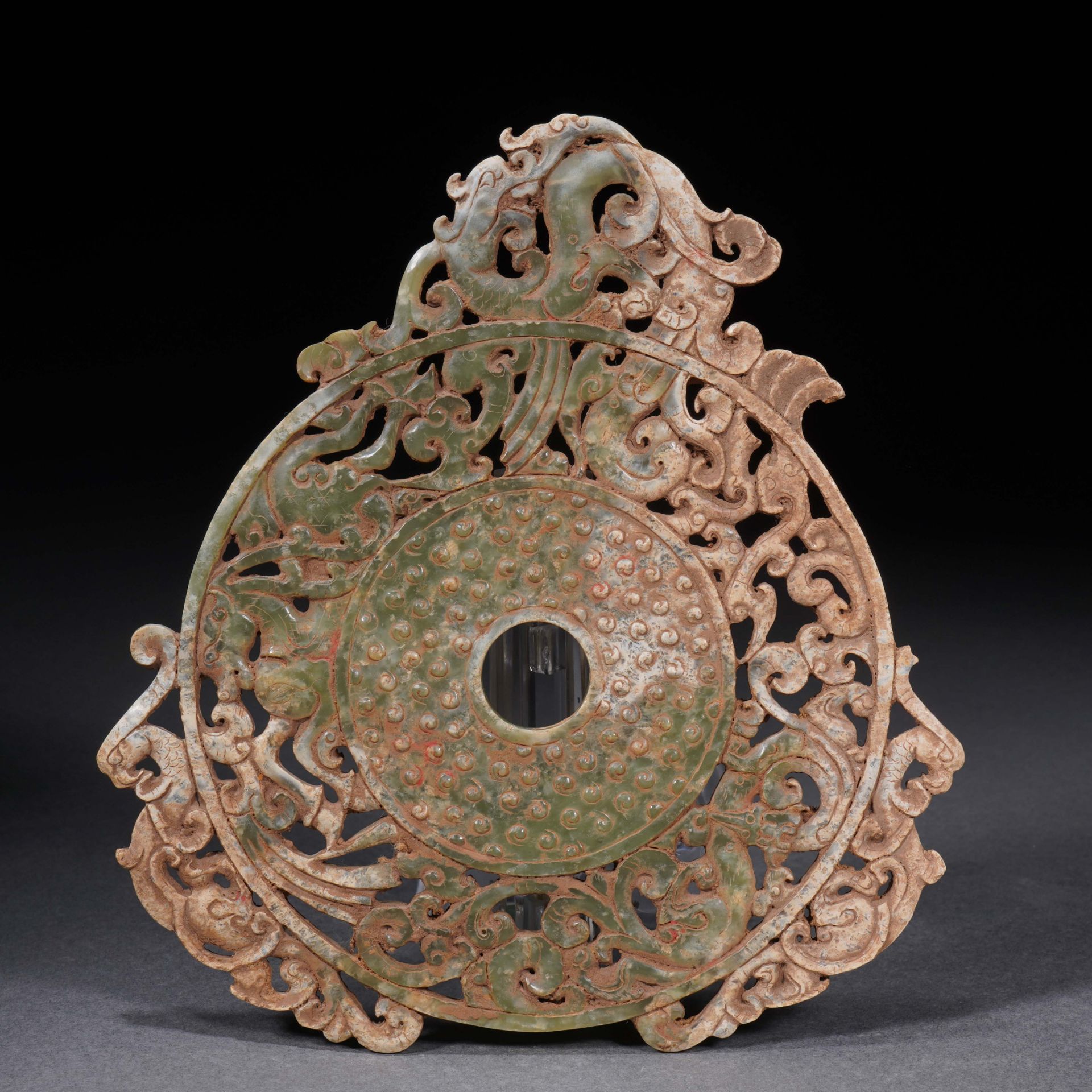 A Chinese Jade Reticulated Dragon Disc Bi