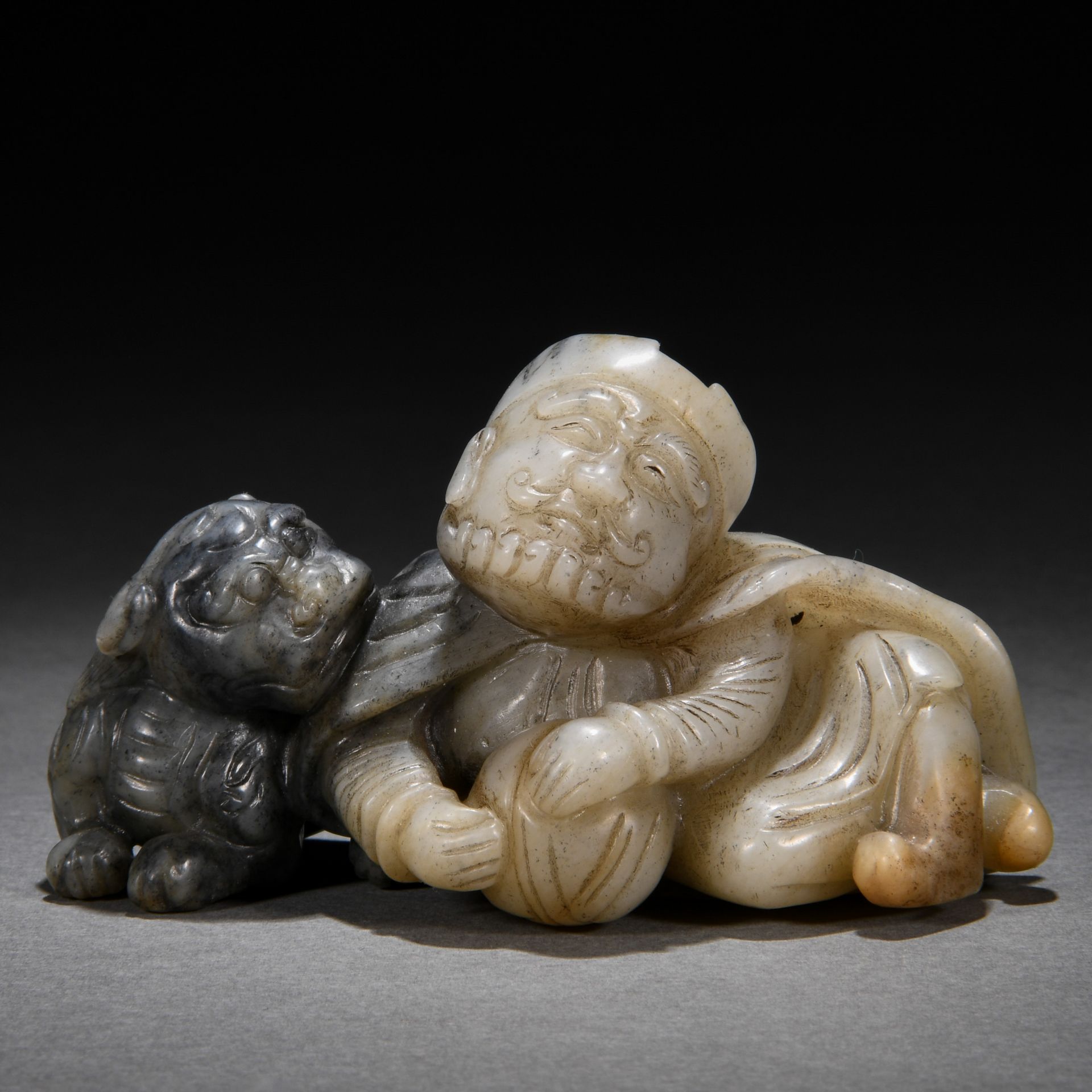 A Chinese Carved Jade Figure with Beast