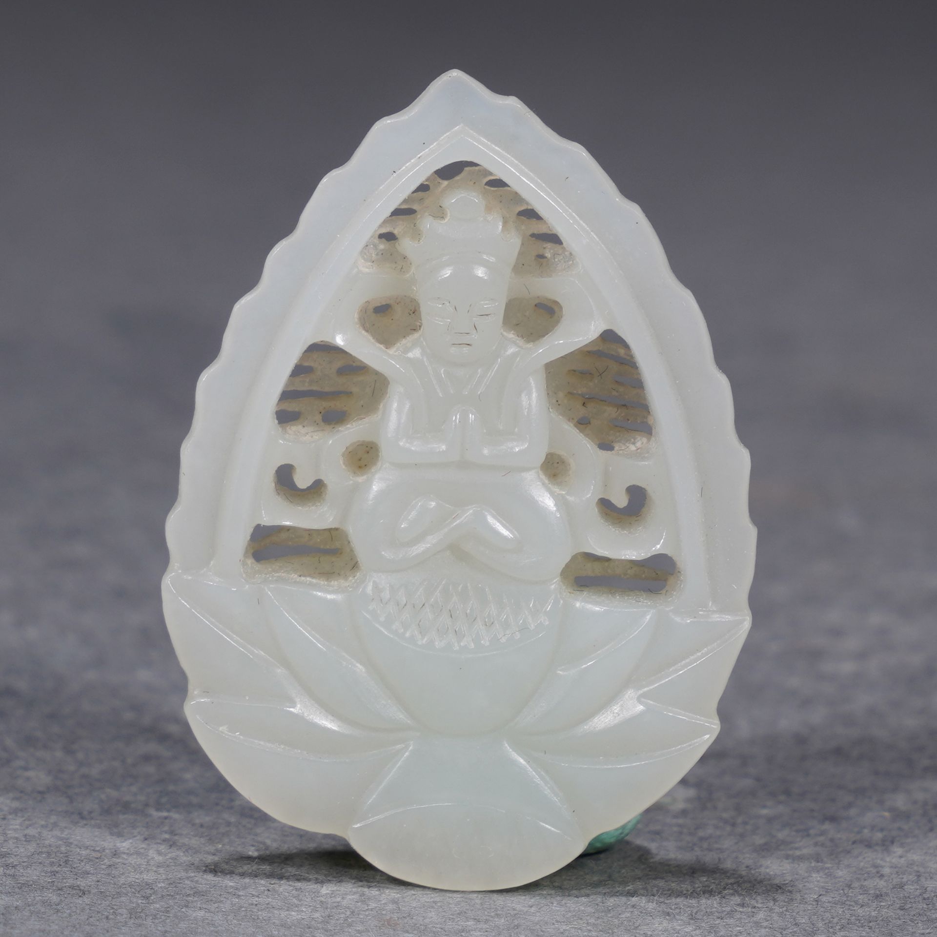A Chinese Carved and Reticulated White Jade Pendant of Bodhisattva