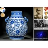 A Chinese Blue And White Peony Scrolls Zun Vase