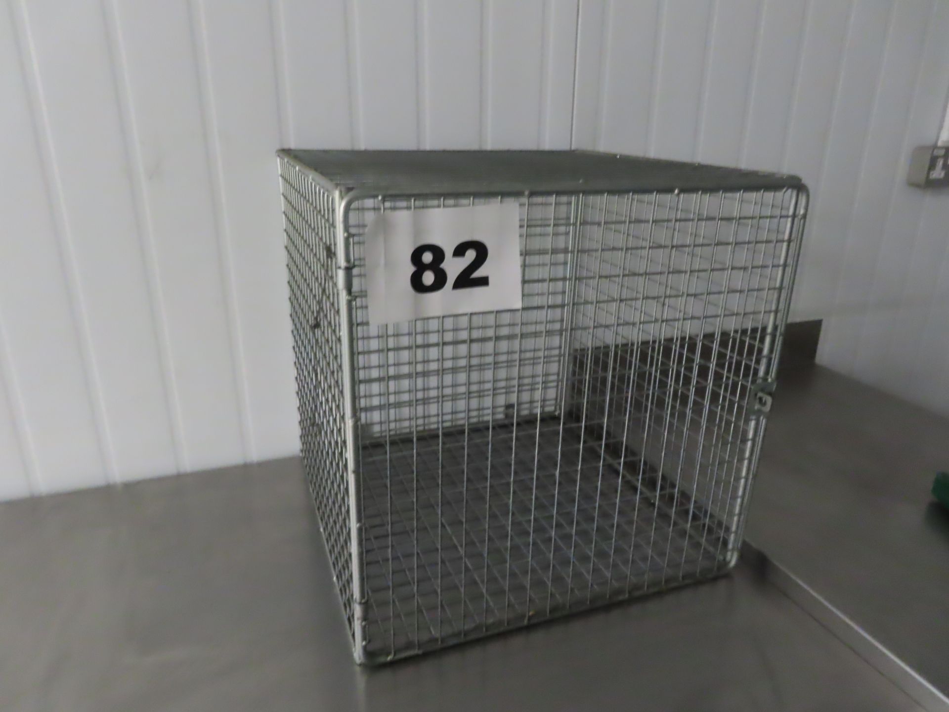STAINLESS STEEL WALL MOUNTED CAGE.