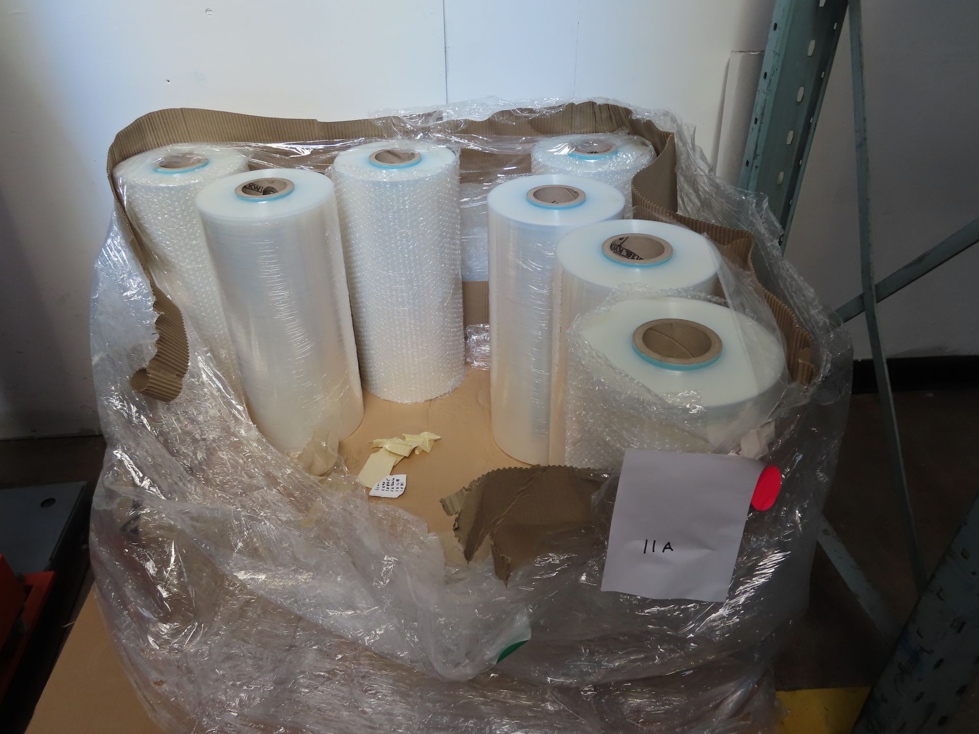 QTY APPROX. 7 ROLLS OF BRAND NEW FILM FOR PALLET WRAPPER.