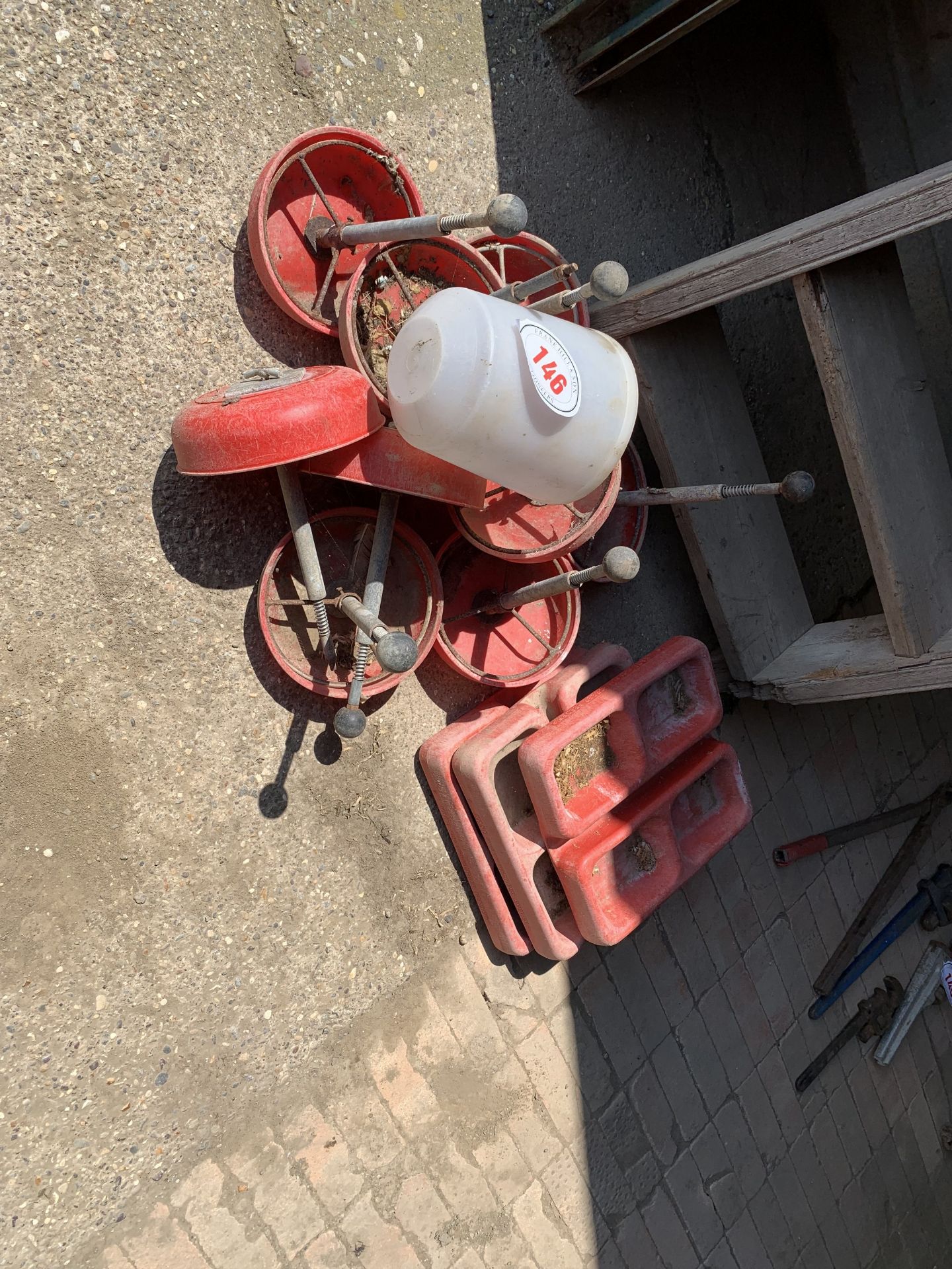 Heap of poultry feeders