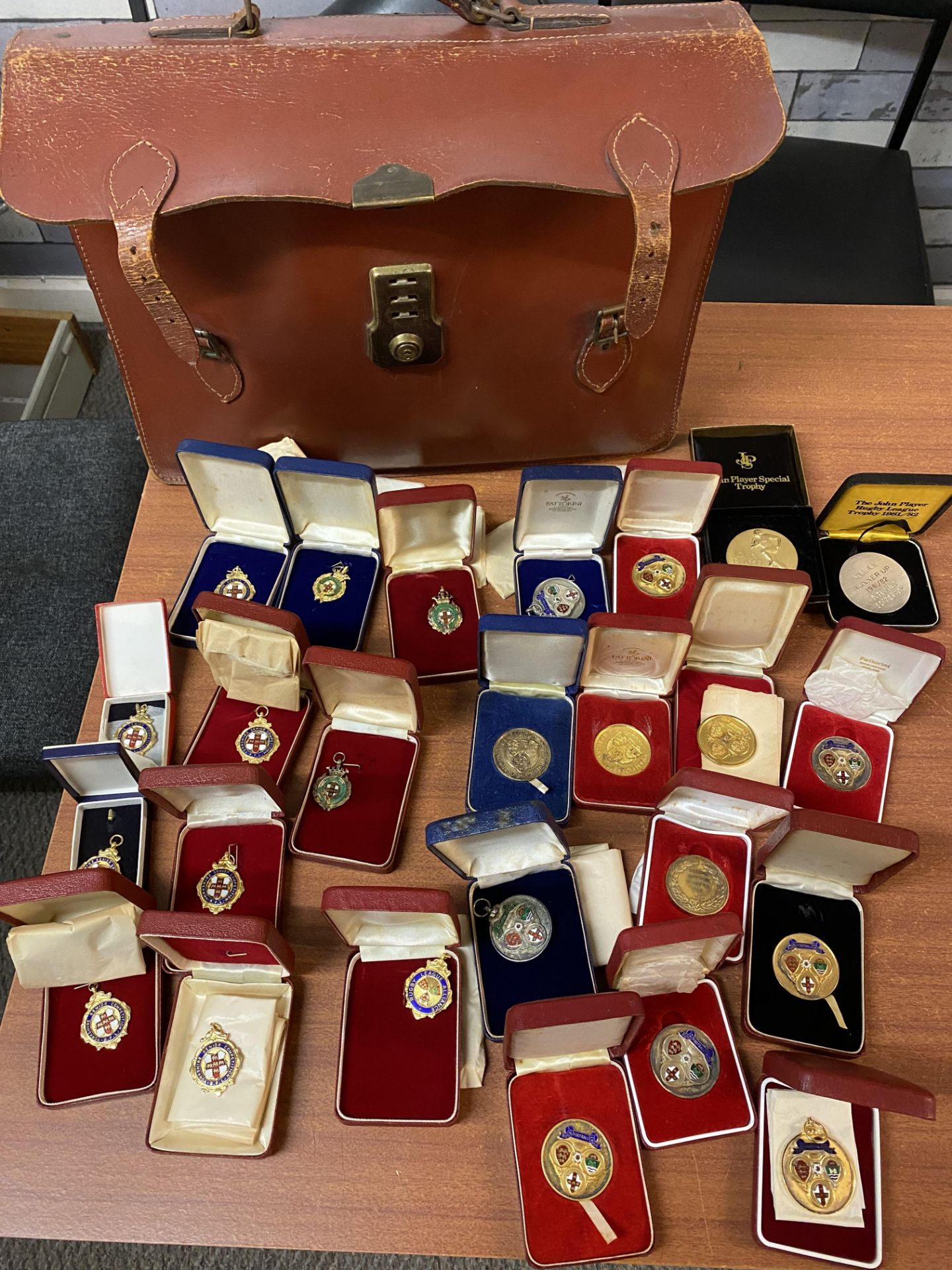 Briefcase containing 24 rugby Hull KR rugby league medals