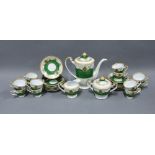 Japanese porcelain coffee set, green and white ground with gilt highlights, 12 place setting