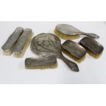 Four piece silver backed dressing table brush set and three silver backed clothes brushes (7)