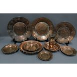 Collection of Middle Eastern coppered tin to include a jug , bowels and chargers, (10)
