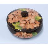 Moorcroft hibiscus jar and cover, 13cm diameter