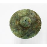 Persian shield boss with fragments of fabric, 15cm diameter. Provenance: Axel Guttmann collection