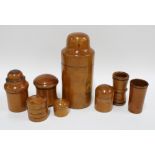A collection of eight treen and boxwood containers to include a large cylindrical box with domed