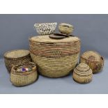 Collection of seven African and other baskets, largest 42cm diameter, place mats and a bead belt (