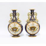 A pair of Italian Ginori majolica vases, with dolphin handles and painted panels, signed and