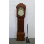 19th century mahogany longcase clock with a carved arched top over a painted dial inscribed Winters,