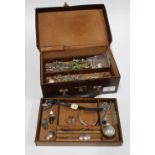 Vintage brown leather jewellery box containing silver and white metal jewellery to include charm