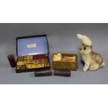 Set of early 20th century printer blcoks, vintage blonde fur rabbit, leather dice holders and a