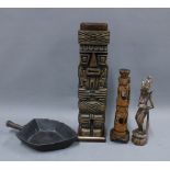Carved wooden totem style figure with detachable top, a wooden shovel and two Eastern carved wood