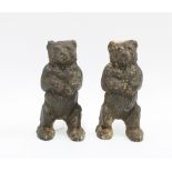 A pair of late 19th / early 20th century cast iron bears, with remnants of paint, 15cm