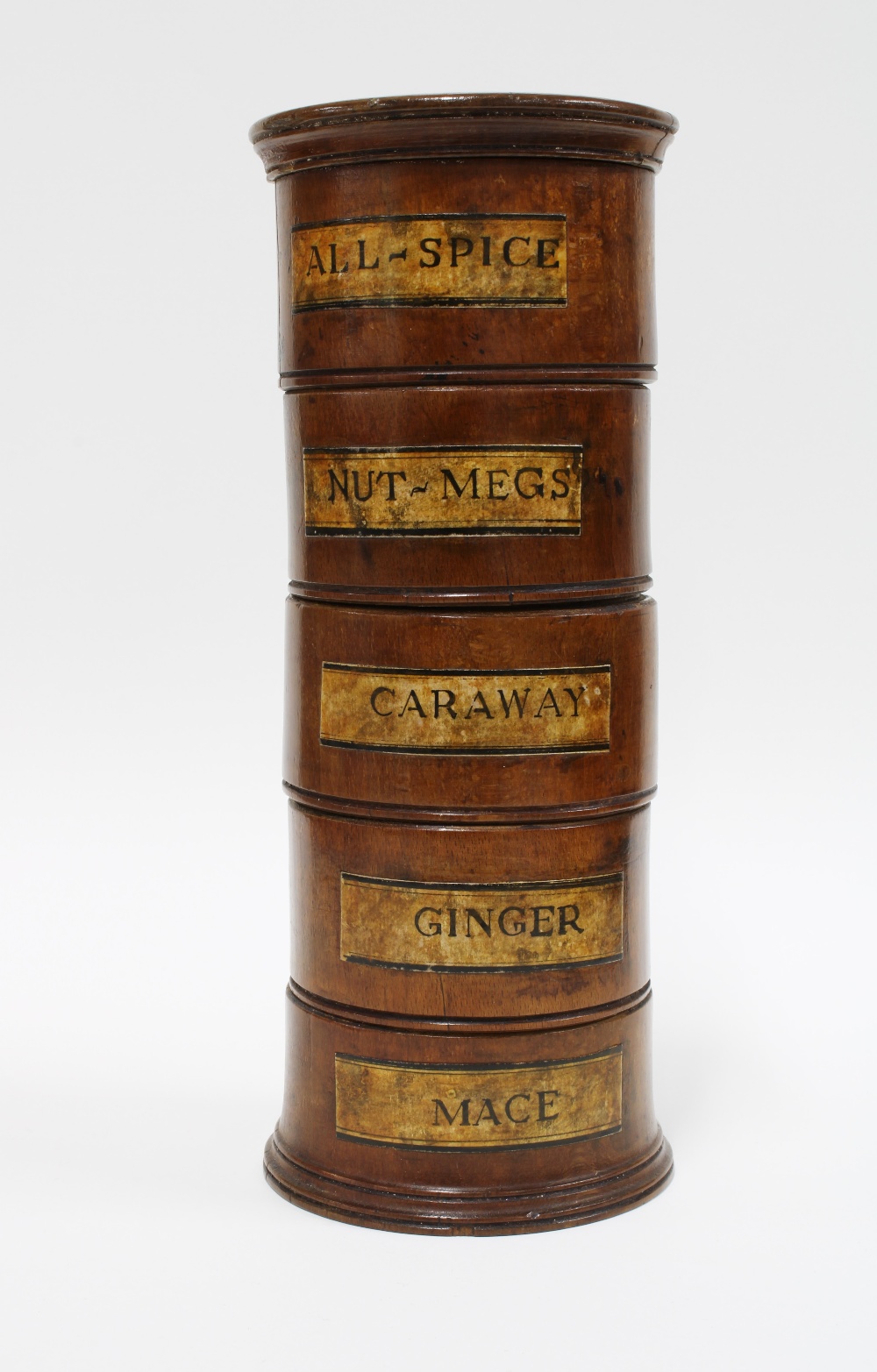Treen spice tower with five sections with paper labels for All- Spice, Nut-Meg, Caraway, Ginger
