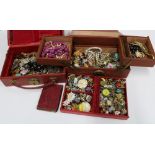 Two leather jewellery boxes containing a selection of vintage and later costume jewellery (a lot)