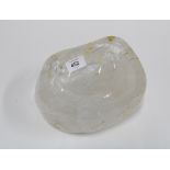 Large rock crystal with polished rim and a shallow well, 21cm wide