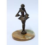 Art Deco style bronze patinated metal figure of a girl in stylistic dress, on a hardstone base, 15cm