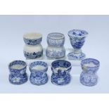 Seven various 19th century Staffordshire blue and white transfer printed egg cups, (7) (a/f)