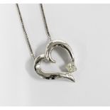 18ct white gold diamond heart pendant on an 18ct white gold chain, stamped 2000, 750