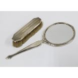 George VI silver backed hand mirror, Birmingham 1938 and a silver backed clothes brush, Birmingham