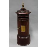 20th century stained mahogany table top post box, cylindrical form with domed top having acorn