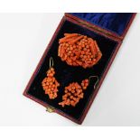 Late 19th / early 20th century coral brooch and earrings set, in the form of grapes, (3)
