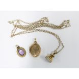 9ct gold necklace with yellow metal 'Anne' seal, yellow metal locket and a paste set pendant (3)