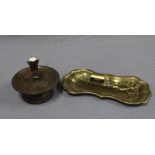 Art Nouveau style bronzed metal candlestick, the drip tray with stylised leaf and flowerhead