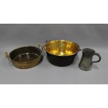 Brass jelly pan with swing handle and another brass pan with side handles and two pewter tankards (