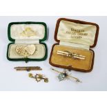 Three 9ct gold bar brooches, an unmarked yellow metal bug brooch and a gold plated Mizpah brooch (5)