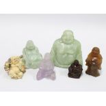 Six various Buddhas to include jadeite, quartz and faux ivory, 9cm (6)