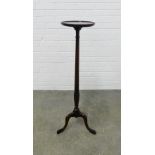 Mahogany torchere stand with circular dished top and tripod base. 107 x 39cm.