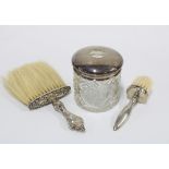 Silver and glass hair tidy jar, Birmingham 1918 and two silver handled table brushes (3)