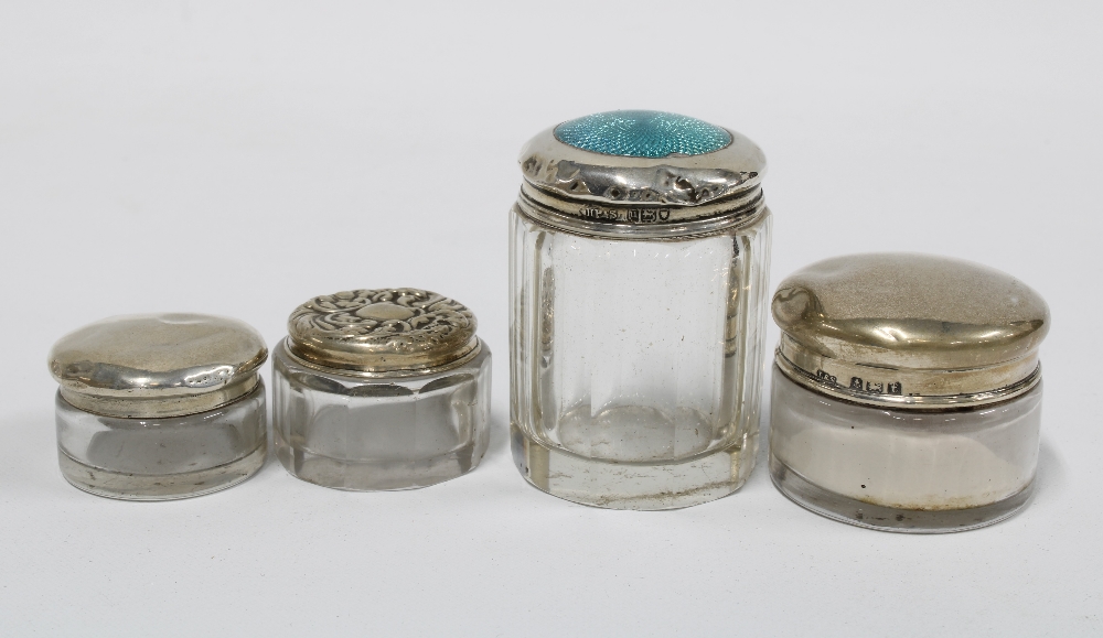 A group of four silver topped glass jars, various hallmarks, tallest 5cm (4) - Image 2 of 2