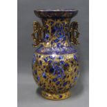 Large chinoiserie baluster vase with underglaze blue and white floral pattern and overlaid