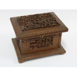 Chinese carved wood jewellery box, the hinged lid with figures and village life, the interior with a