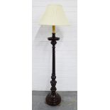 Mahogany standard lamp with brass paw feet, 150cm