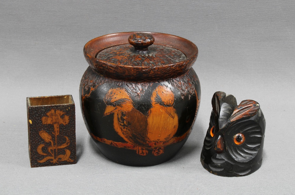 Pokerwork tobacco jar together with two match box holders, one inthe form of an owl. 12cm. (3)