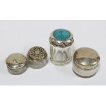 A group of four silver topped glass jars, various hallmarks, tallest 5cm (4)